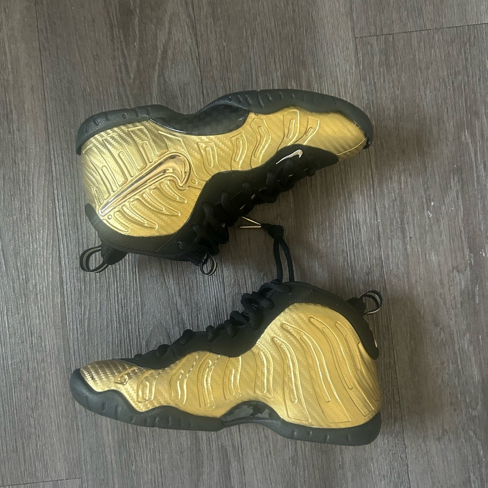 Nike Black and Gold Foamposite Sneakers